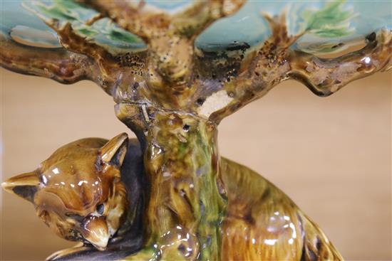 A George Jones majolica comport, the pedestal modelled as a tree trunk with a fox chasing a rabbit,